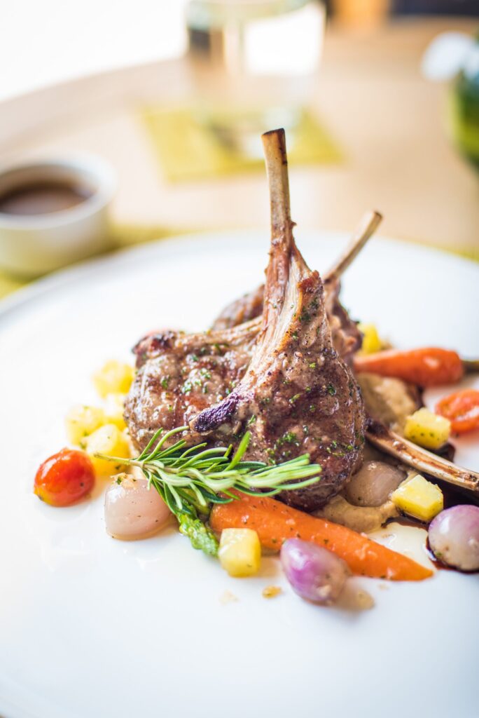 A Culinary Symphony: Herb-Crusted Lamb Chops with Roasted Vegetables